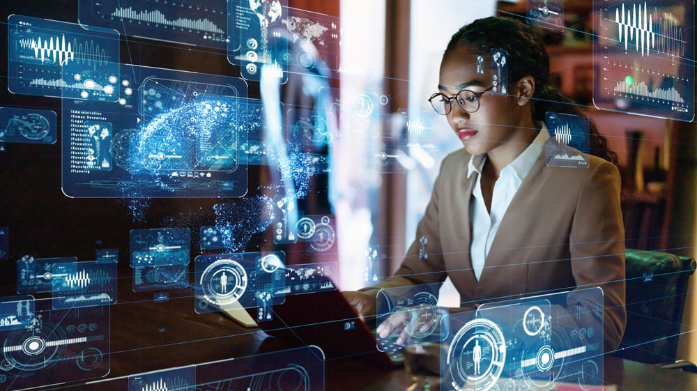 A data engineer and scientist working on her computer.