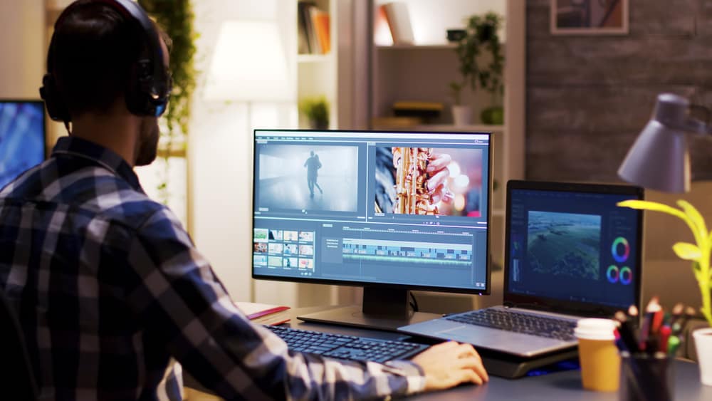 A close look at a video editor editing a video on computer.