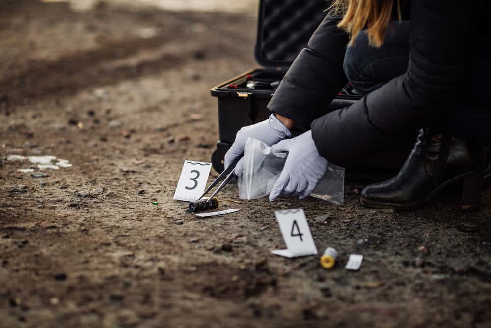 Crime scene investigator collecting evidence.