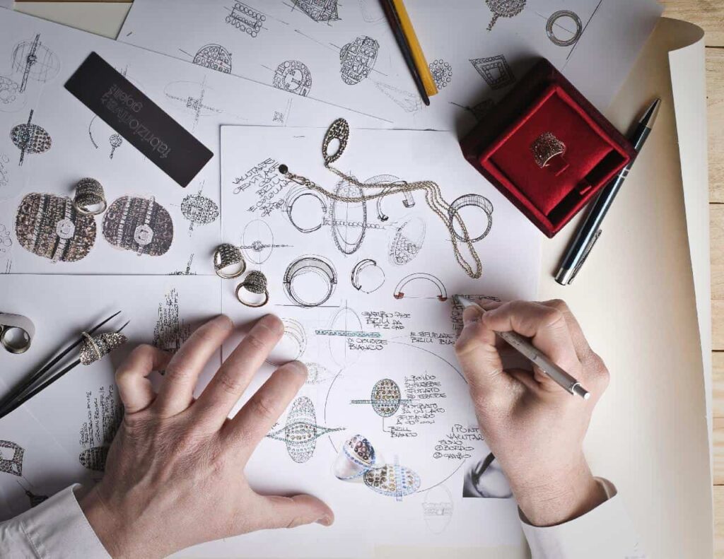 Jewelry designer sketching jewelries.