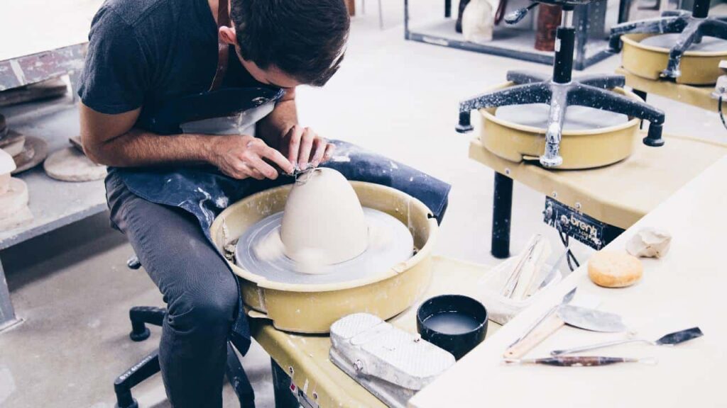 Man sculpting a pot,