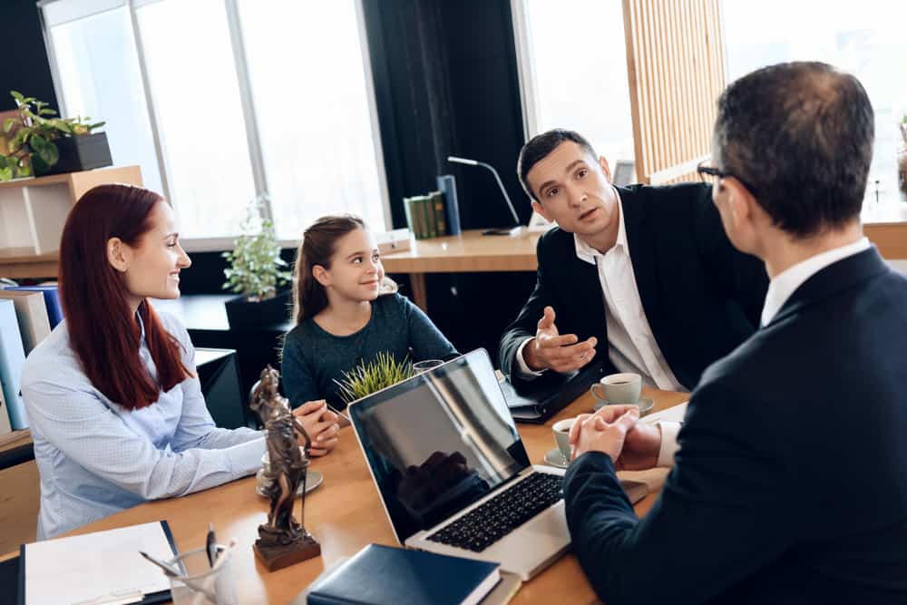 Lawyer giving advice to his family client in the office.