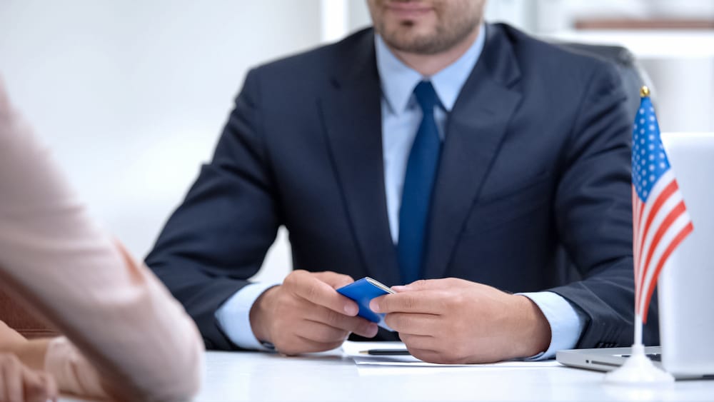 Immigration lawyer assisting client with her visa.