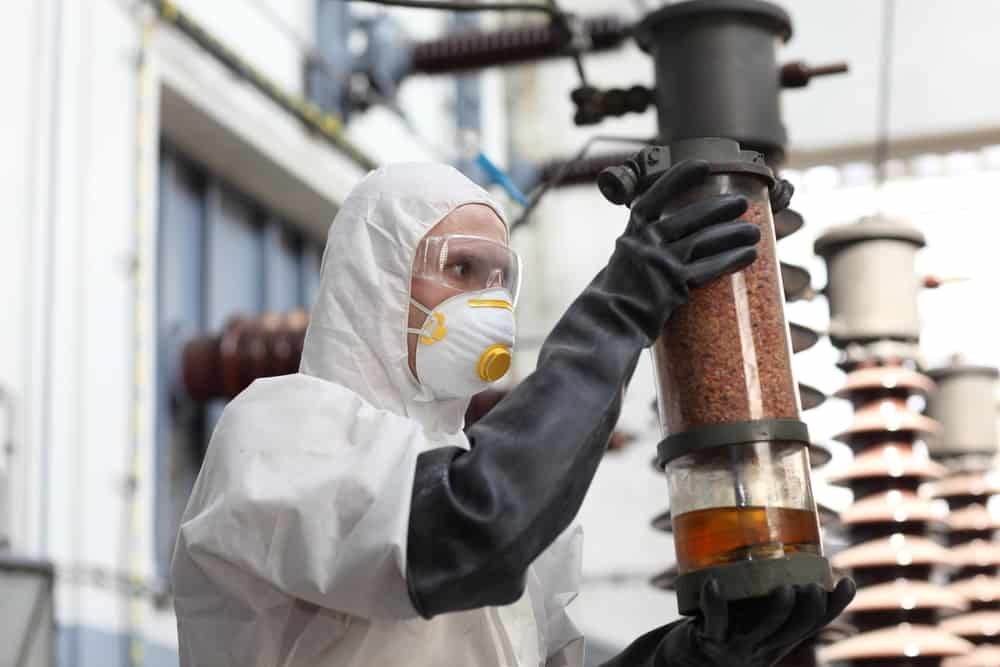 Nuclear engineer inspecting an output in the powerplant.