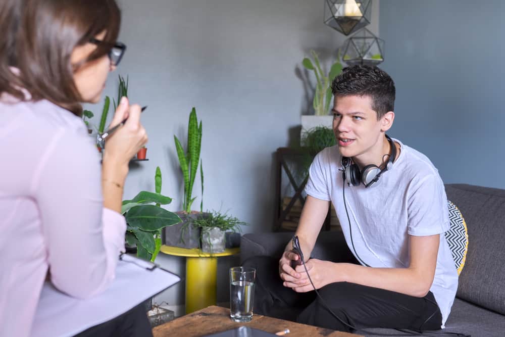 School guidance counselor advising the teenage boy.