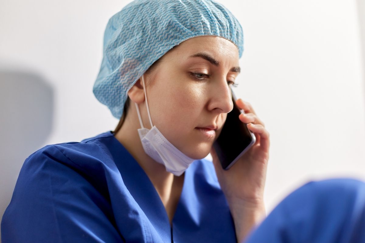 Close up of a sad young female nurse.