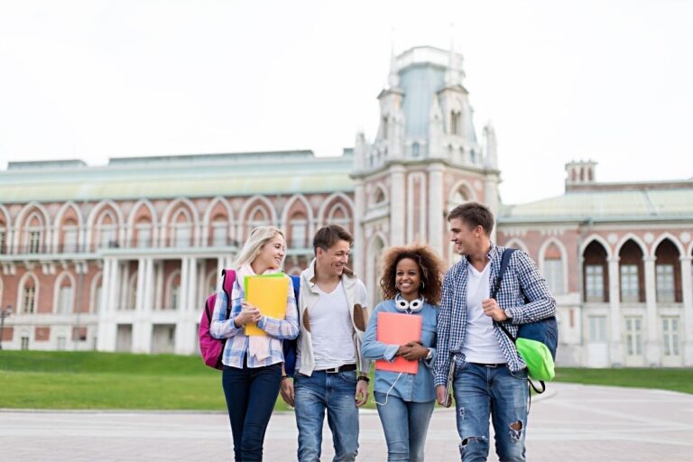 Young college students in a park of university.
