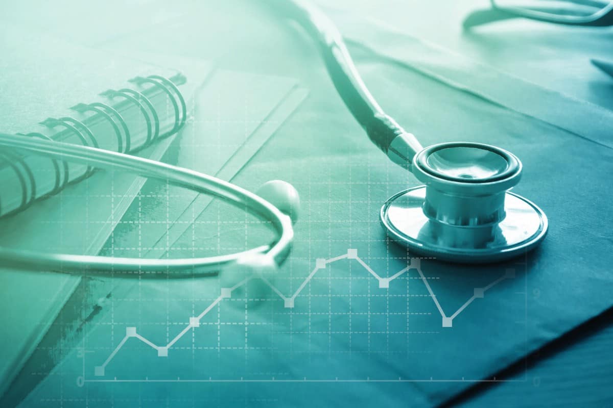 Healthcare concept with stethoscope and business graph.