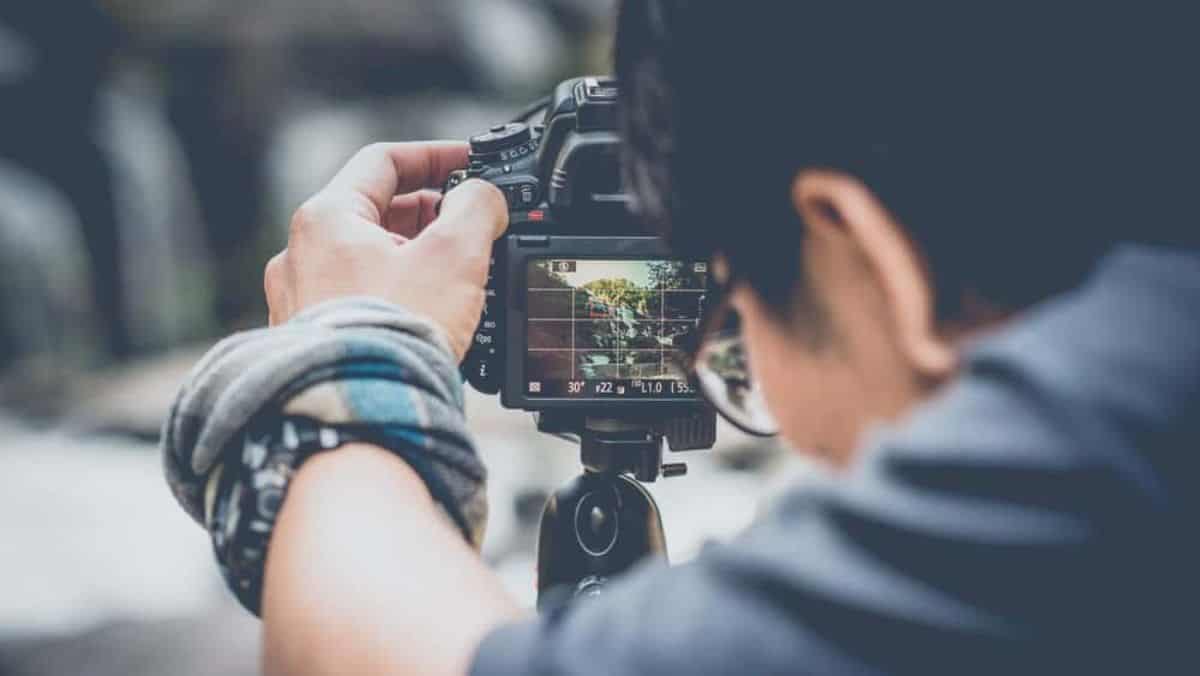 Photographer looking behind the camera.