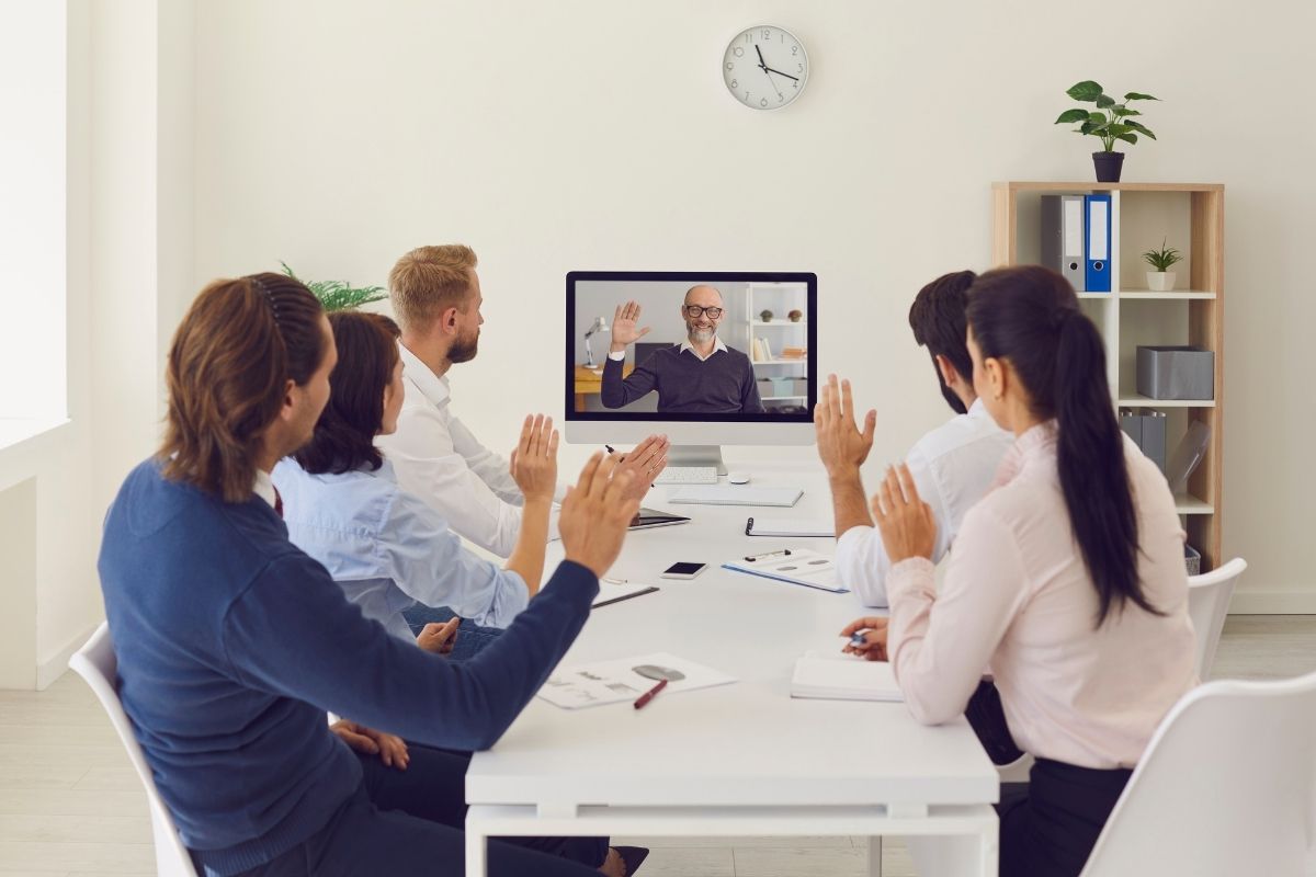 Company managers sitting at conference table in office having a meeting with the director.