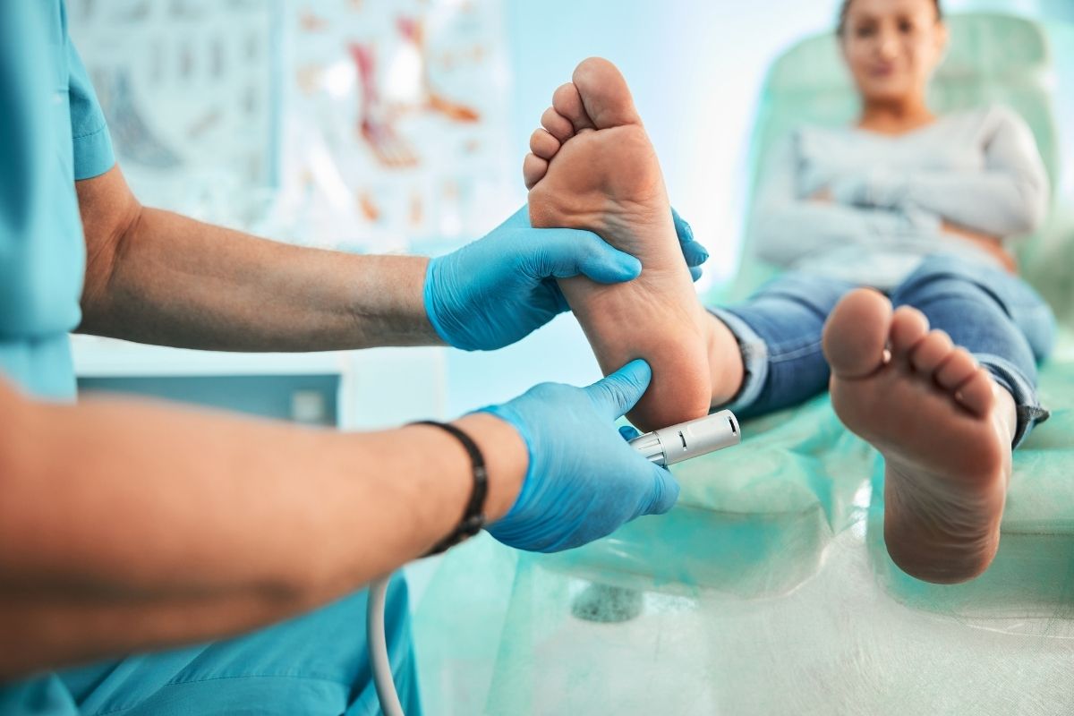 Podiatrist using special grinding equipment.