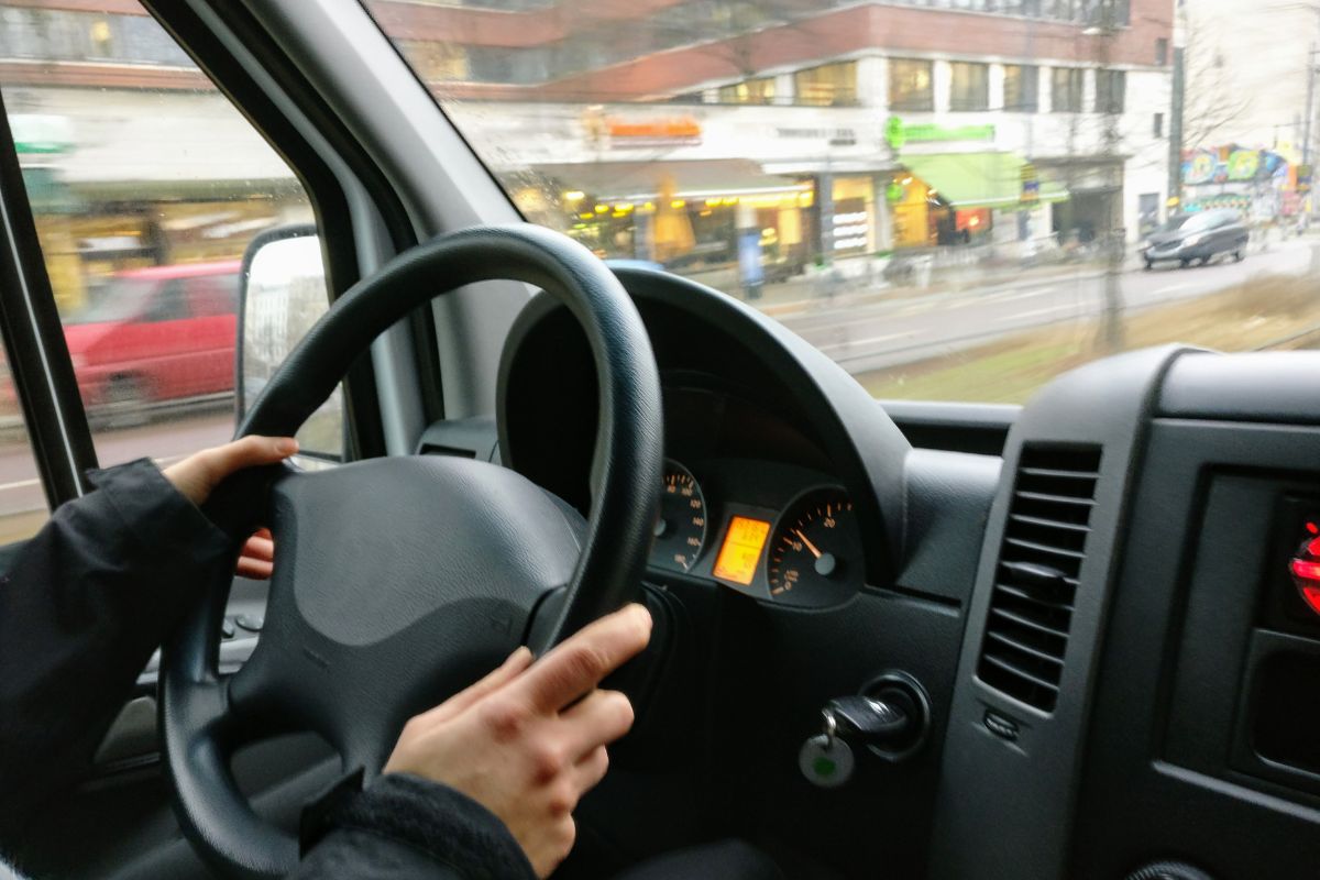 A driver inside the car driving so fast.